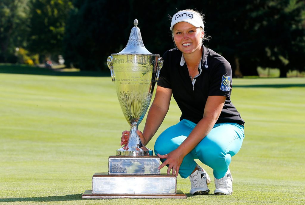 PORTLAND, OR - AUGUST 16: Brooke Henderson of Canada poses with the trophy after her 21 strokes under par victory during the final round of the LPGA Cambia Portland Classic at Columbia Edgewater Country Club on August 16, 2015 in Portland, Oregon. (Photo by Jonathan Ferrey/Getty Images)